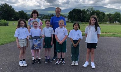 0261112_Principal__Brian_O_Sullivan_and_Students_from_Loreto_National_School_presenting_their_donation_of_used_glasses_to_Mairead_Broderick__Killarney_Lions_Club.JPG